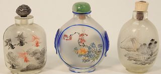 Three Reverse Painted Snuff Bottles including two with landscape scenes; one with koi fish.
largest height 2 5/8 inches.
Provenance:...