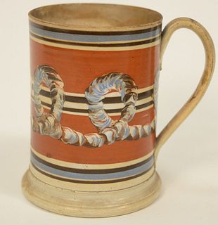 Large Mocha Footed Mug having banding and tri-color cable (staining).
height 6 inches.