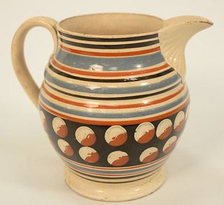 Mocha Jug with Large Spout, slip banding and cat eyes on footed base (crack at foot).
height 6 7/8 inches.
Provenance: Estate of Mic...