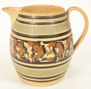 Mocha Jug having banding and tri-color cable design, fine cracks and small chips.
height 7 inches.