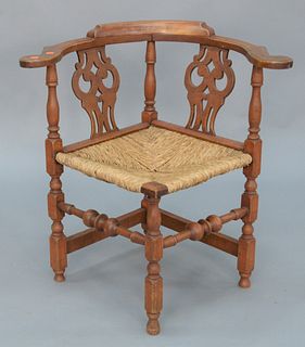Corner Chair with carved splats and rush seats on block turned legs with bold stretchers, 18th century.
height 27 1/2 inches, seat h...