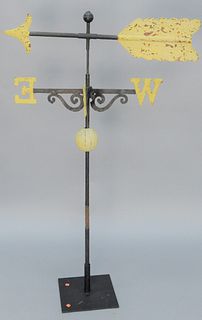 Iron Arrow Weathervane with iron directional, on stand.
total height on stand 60 inches, length 39 inches. 
Provenance: From the Mar...