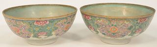 Pair Famille Rose Footed Bowls, each marked with six character marks, interior of each with water stains.
height 3 1/4 inches, diame...
