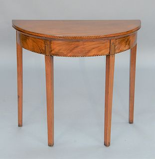 Federal Mahogany Demilune Games Table having barber pole inlay on legs and skirt, circa 1790.
height 29 1/2 inches, width 33 inches.