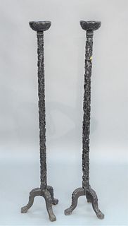 Pair Chinese Hardwood Carved Tall Stands with carved tops, pedestal and tripod base.
height 62 inches.
Provenance: From the Robert C...