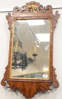 Mahogany Chippendale Mirror with gilt phoenix bird, 18th century.
height 32 inches, width 19 inches.
Provenance: Estate of Dr. Thoma...