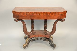 Federal Mahogany Games Table having shaped top supported by two carved dolphins set on base with four dolphin legs, circa 1830.
heig...