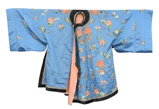 Chinese Silk Embroidered Robe, light blue having embroidered flowers with some gold threading, lined with peach silk.
length 41 inches.