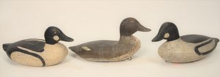 Three Sam Collins (or family) Decoys, Essex, Connecticut, to include two goldeneye drakes and one hen, late 19th or early 20th centu...