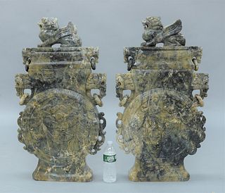 Pair of Large Moon Flasks Hardstone Covered Urns, having carved foo dog handles with rings, central body carved with two dragons on ...