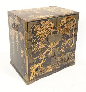 Japanese Black Lacquered Cabinet, brass mounted with raised gold chinoiserie decoration of birds and leaves, two doors opening to th...