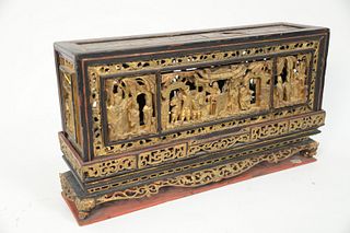 Chinese Gilt and Lacquered Carved Wood Panel Box or Stand set on dragon head feet.
height 10 inches, 4 3/4" x 17 3/4".
Provenance: F...