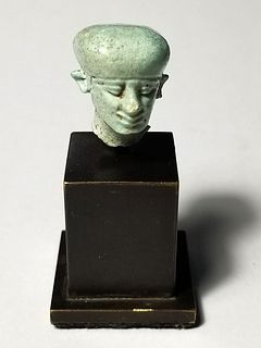 A Faience Egyptian Head of Paitakos Late Dynastic Period. 664-332 BCE.