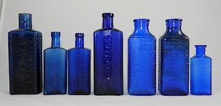 Poison - 7 rectangular cobalt bottles