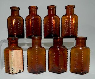 8 Amber poison bottles