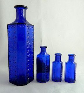 Poison - 4 irregular hexagonal cobalt bottles