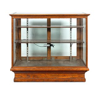 E. 20TH C. OAK AND GLASS STORE DISPLAY CASE