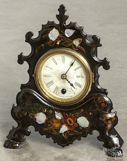 Cast iron front shelf clock with mother-of-pearl inlay, 11 1/2'' h.