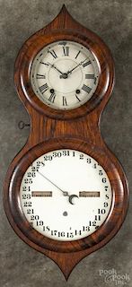 Seth Thomas rosewood double dial peanut calendar clock, 23 1/2'' h.