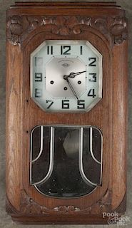 French Girod carved walnut wall clock with a Westminster chime, 27'' h.