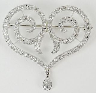 Lady's vintage round cut diamond and platinum heart shape pendant/brooch.