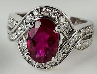 Lady's approx. 2.0 carat oval cut red tourmaline, .55 carat diamond and 14 karat white gold ring.