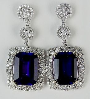 Pair of lady's approx. 22.0 carat gem quality emerald cut amethyst, 6.50 carat round cut diamond and 18 kpendant earrings.