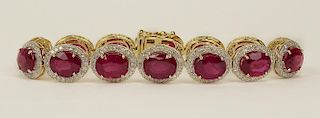 AIG Certified 33.65 Carat Oval Mixed Cut Natural Rubies, 2.58 Carats Round Brilliant Diamonds and 14 K bracelet.