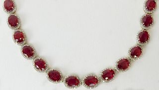 AIG Certified 64.16 Carat Oval Mixed Cut Natural Rubies, 5.81 Carats Round Brilliant Diamonds and 14 K Necklace.