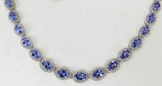 AIG Certified 19.06 Carat Oval Mixed Cut Natural Tanzanite, 4.84 Carat Round Brilliant Diamond and 14 K Necklace.