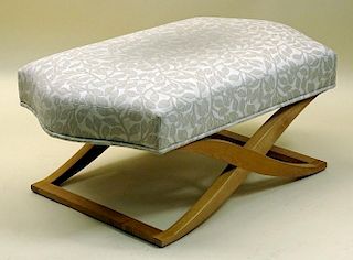 Bench/ottoman by Angelo Donghia features an X-shaped blonde wood base and a comfortable seat.