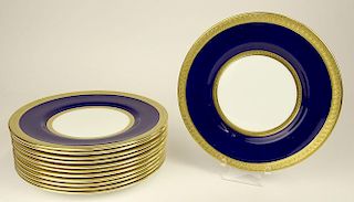Set of Twelve (12) Coalport porcelain dessert plates with cobalt and gold rims.