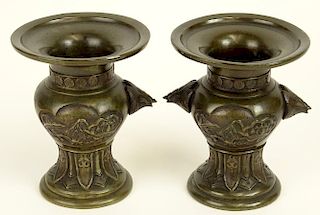 Vintage pair of miniature Japanese bronze urns. Floral Motif.