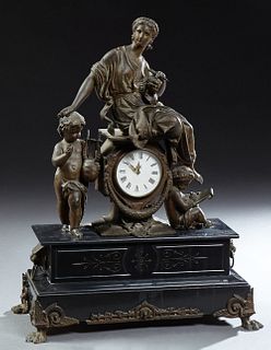 French Patinated Spelter and Black Marble Mantel Clock, 19th c., with a figure of a classical female sculptress atop a drum clock, f...