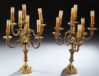 Pair of French Bronze Seven Light Candelabra, early 20th c., with a central raised candle arm flanked by six relief curved candle ar...