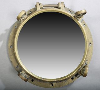 Solid Bronze Large Ship's Port Hole, 20th c., now mounted with a mirror, H.- 6 1/2 in., Dia.- 18 in.