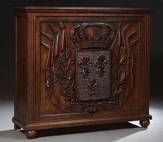 French Carved Walnut Sideboard, 19th c., the stepped top over double relief carved doors with a crown over a fleur-de-lis carved shi...