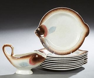 Eleven Piece French Ceramic Fish Form Set, 20th c., by Badonville, consisting of nine plates, a saucer, and a covered tureen, Tureen...