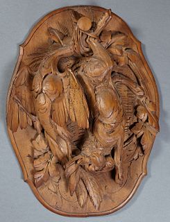 German Carved Walnut High Relief Natur Morte, 19th c., of a pheasant and a rabbit, on a shaped oval back plate, H.- 21 in., W.- 15 1...