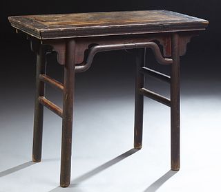 Chinese Mu Wood Wine Table, 19th c., the rectangular top on pierced curved bracket supports, to cylindrical legs joined by a stretche..