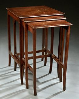 Nest of Three Art Nouveau Marquetry Inlaid Mahogany Side Tables, c. 1900, the rectangular tops with inlaid foliate decoration on squ...