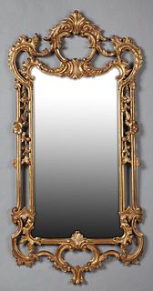 French Style Gilt and Gesso Overmantle Mirror, 20th c., the pierced scrolled crest over a pierced scrolled, floral relief frame, H.-...