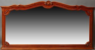 Large French Carved Cherry Overmantel or Backbar Mirror, 20th c., the stepped serpentine top over a conforming wide beveled plate, o...