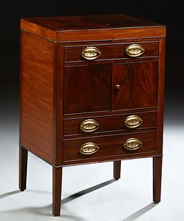 English Georgian Style Mahogany Beau Brummel, 19th c., the fold over top opening to an interior lacking its fittings, above a faux d...