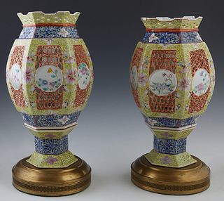 Pair of Chinese Porcelain Candle Lanterns, late 19th c., of hexagonal baluster form, the reticulated sides with floral decorated whi...