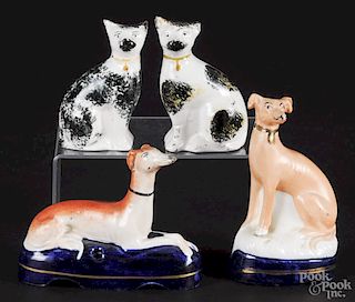 Pair of Staffordshire cats, together with two greyhounds, tallest - 5''.