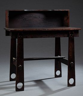 Mission Oak Writing Table, early 20th c., the back with an upper shelf, on rectangular base, on flat tapered legs with spade and cir...