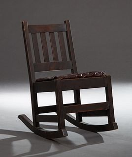 Mission Oak Lady's Rocker, in the manner of Gustav Stickley, early 20th c., the slatted back over a cushioned seat, on square block...