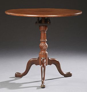 English Carved Cherry Tilt Top Table, 19thc., the circular top tilting over a bird cage, atop a carved tapered pedestal, to a tripod...