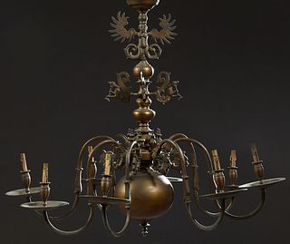 Dutch Style Brass Eight Light Chandelier, 20th c., the knopped support issuing four relief mermaids, and eight scrolled arms, over a...